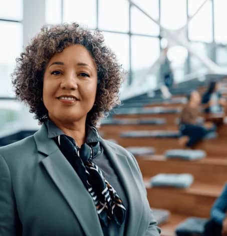 Photo of classroom and teacher