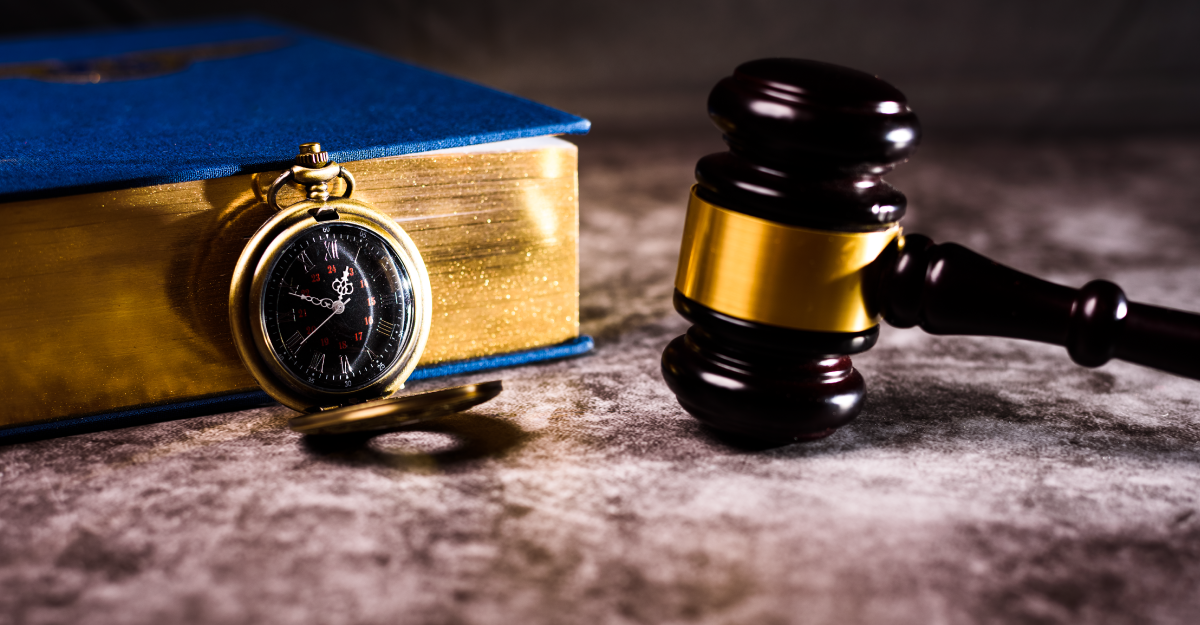 justice gavel, law book and compass