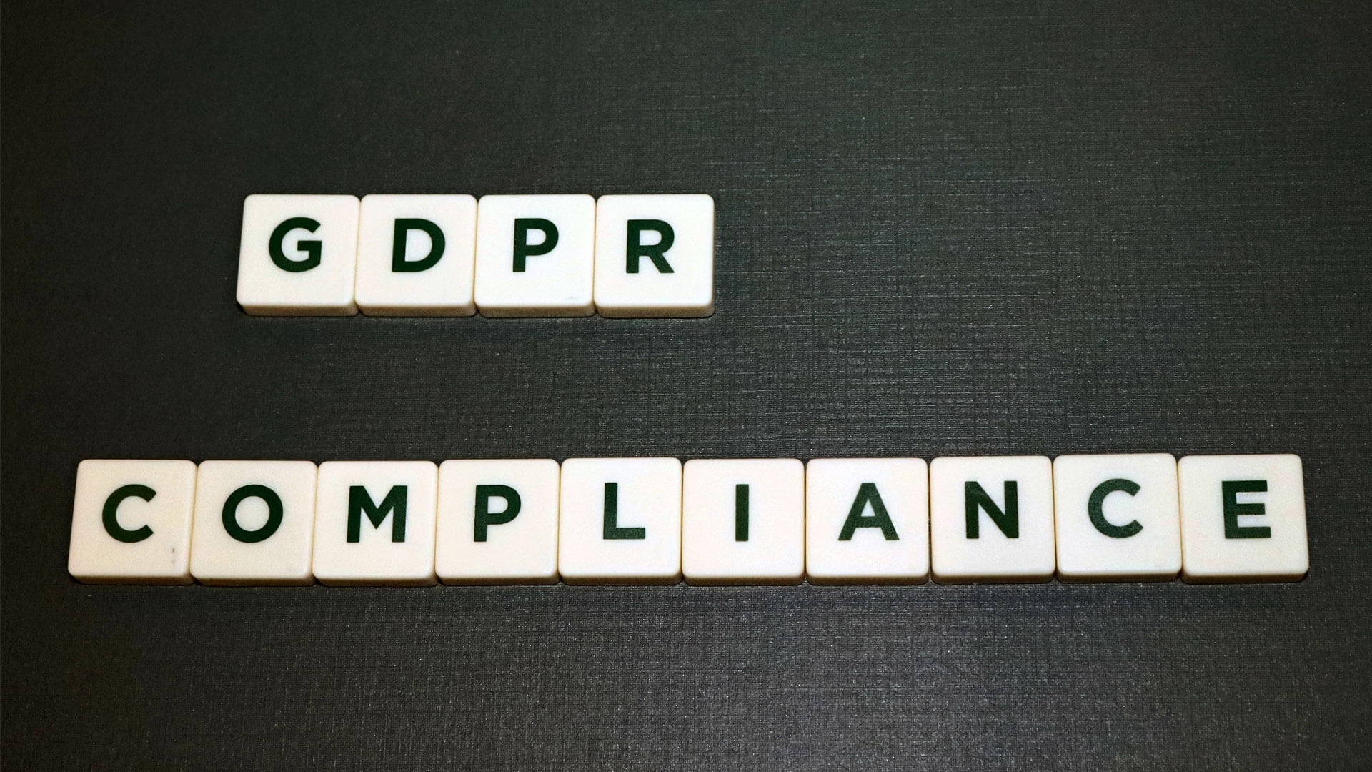 letter tiles spelling GDPR COMPLIANCE