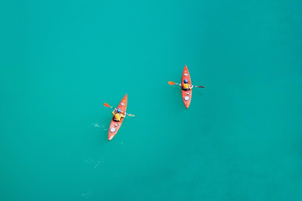 two persons kayaking 