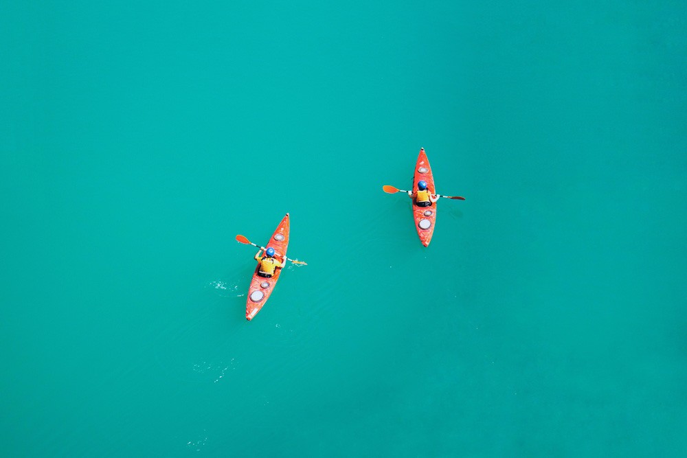 two persons kayaking 