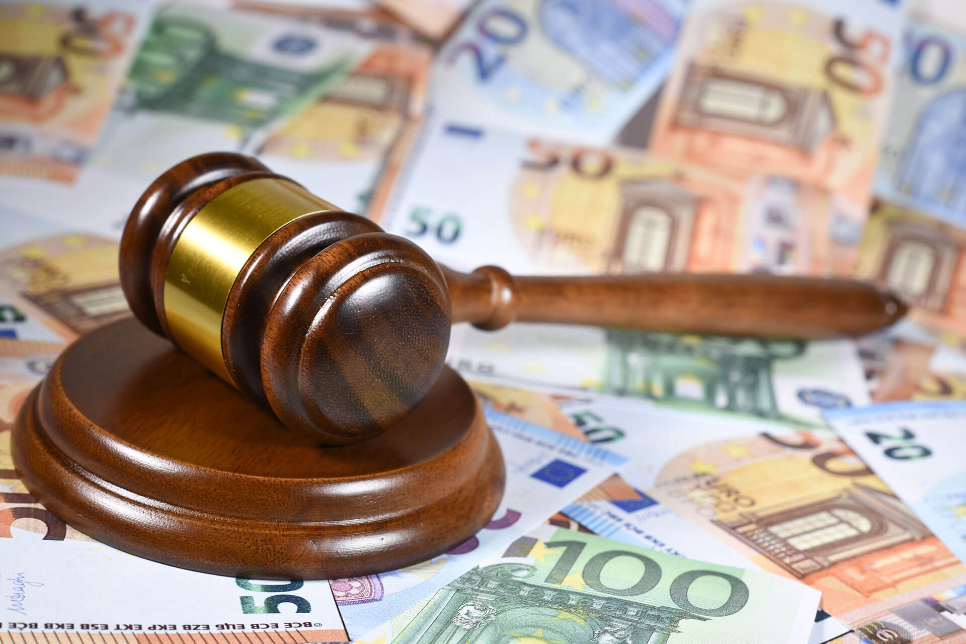 judge gavel on top of euro bills