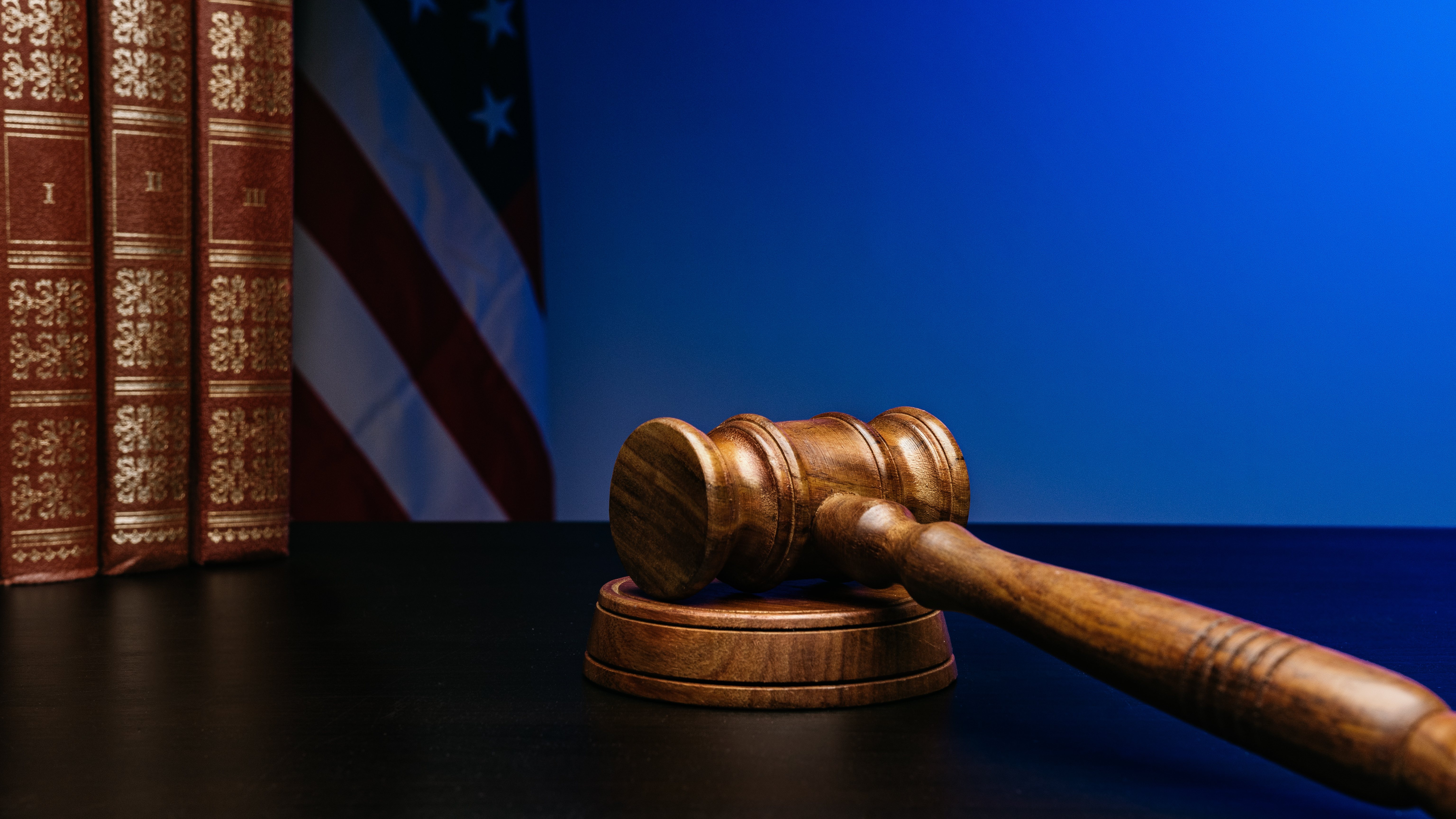 gavel on court desk on background of usa flag