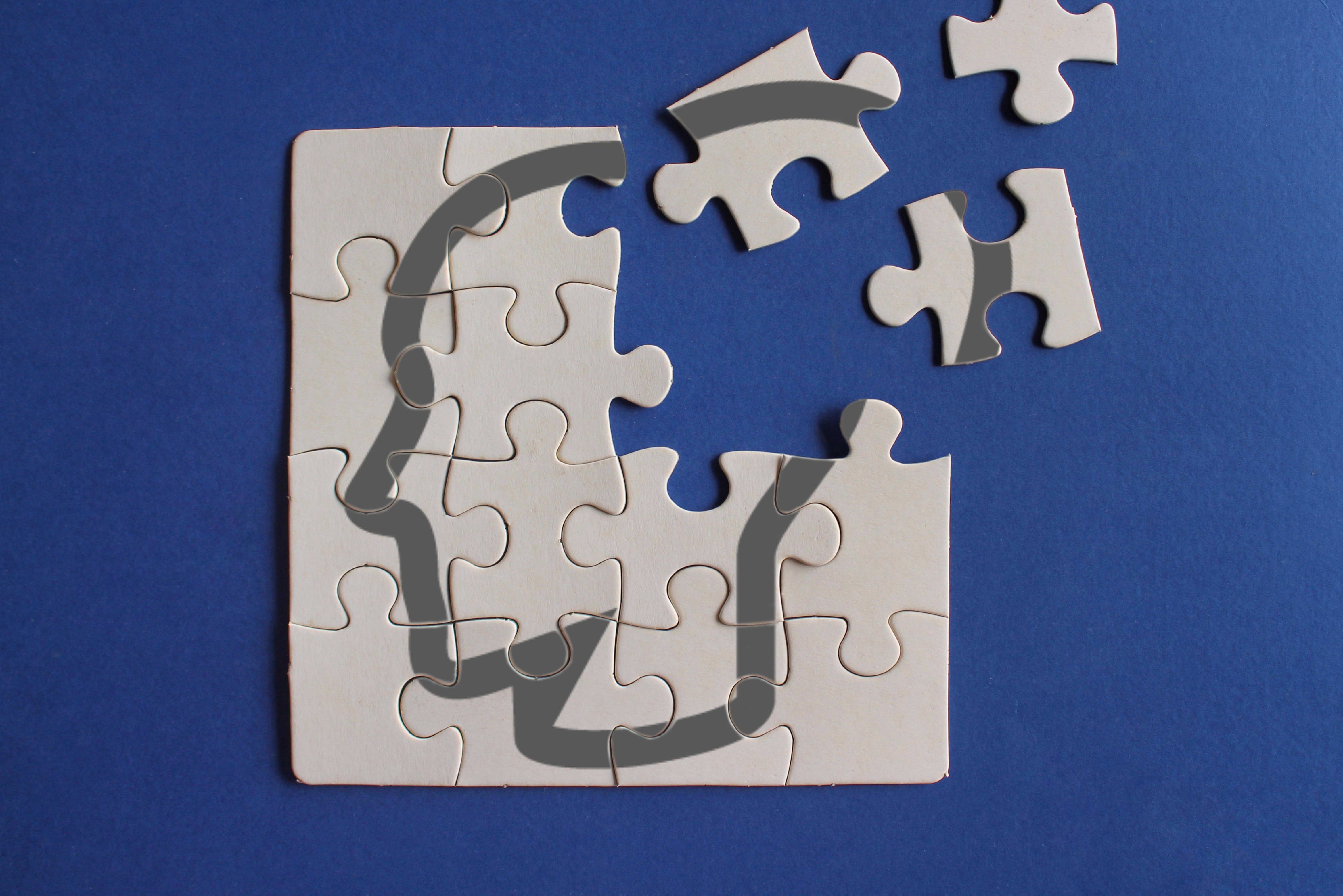 Human head on incomplete puzzle