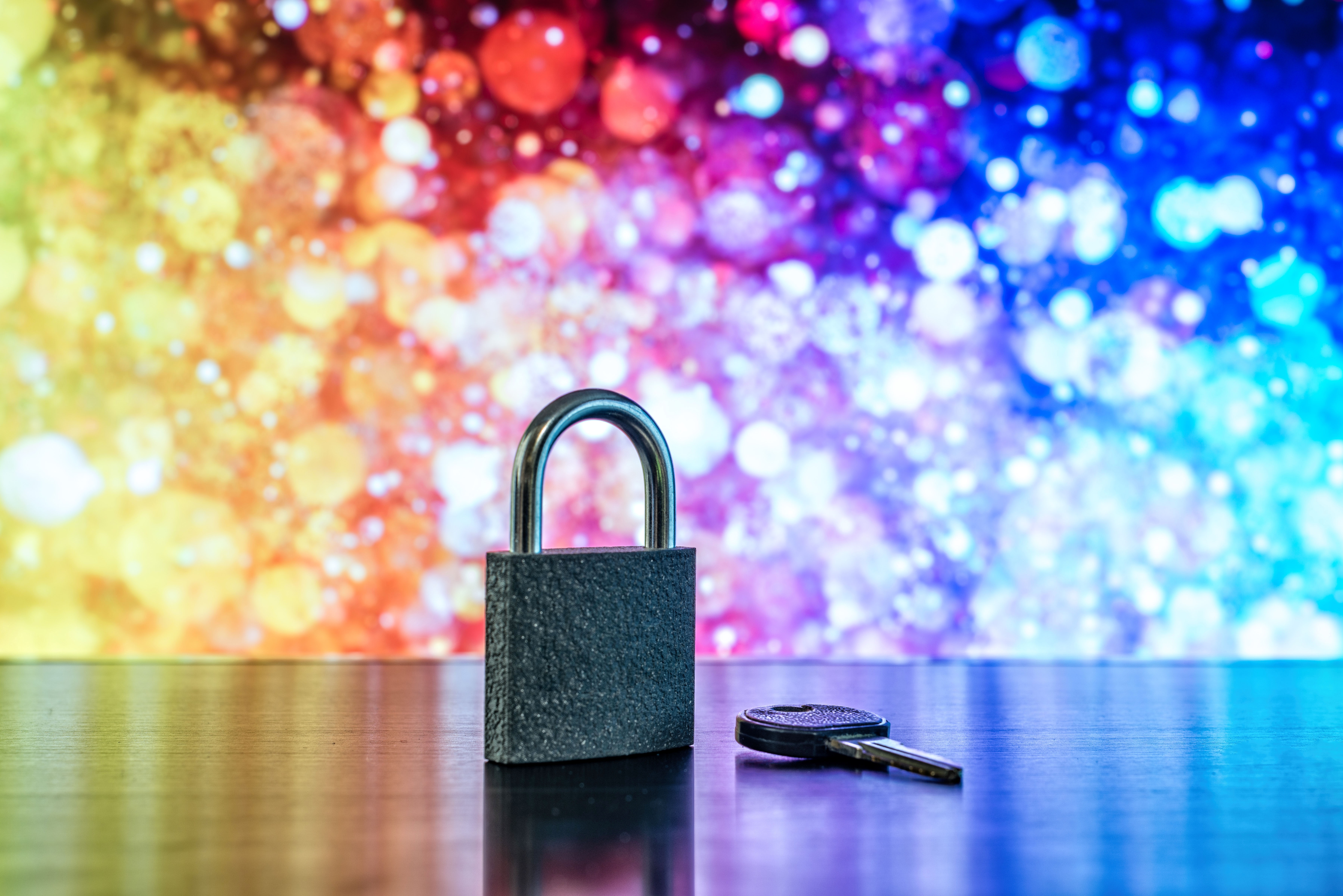 padlock and key with fireworks in the background