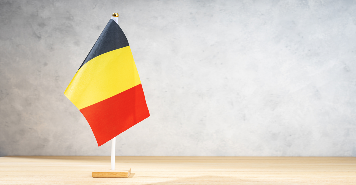 Belgium table flag on white textured wall